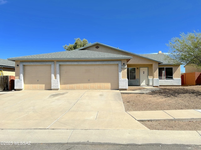 10211 E Hummingbird Meadow Way, Tucson, AZ 85747 - single story home with fence, stucco siding, an attached garage, concrete driveway, and roof with shingles