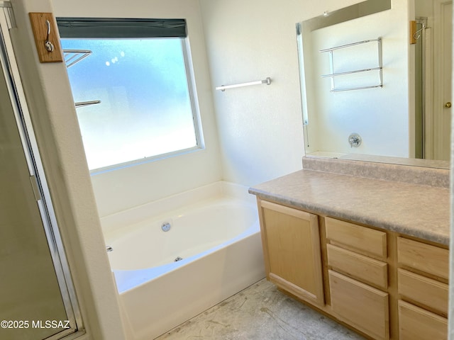 10211 E Hummingbird Meadow Way, Tucson, AZ 85747 - bathroom with a garden tub and vanity