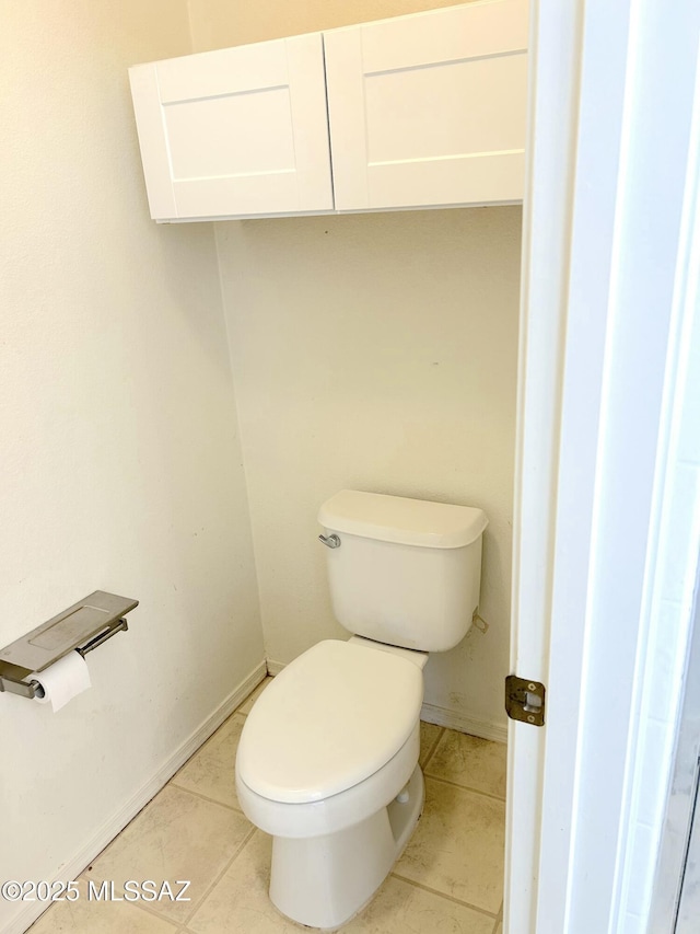 10211 E Hummingbird Meadow Way, Tucson, AZ 85747 - bathroom with tile patterned floors, baseboards, and toilet
