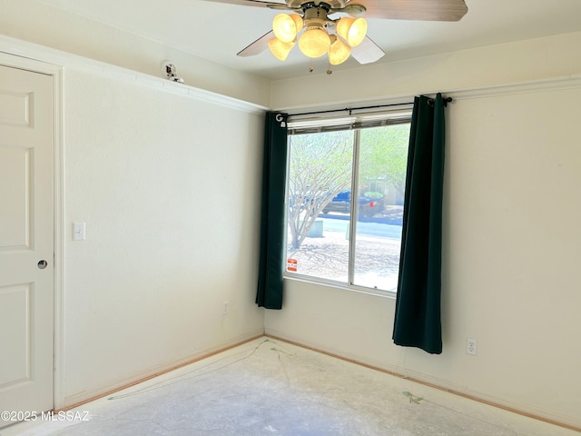 10211 E Hummingbird Meadow Way, Tucson, AZ 85747 - unfurnished room with a ceiling fan, baseboards, and a wealth of natural light