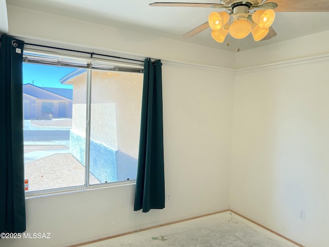 10211 E Hummingbird Meadow Way, Tucson, AZ 85747 - empty room featuring a ceiling fan and baseboards