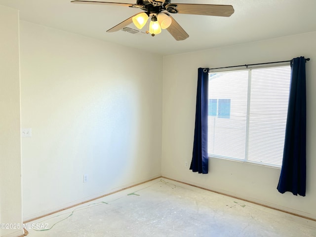 10211 E Hummingbird Meadow Way, Tucson, AZ 85747 - spare room with baseboards, ceiling fan, and unfinished concrete flooring