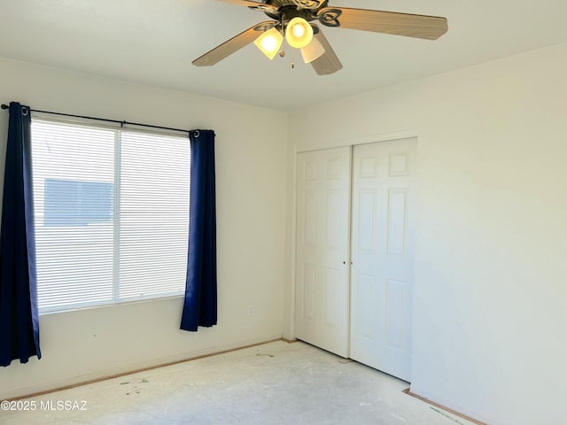 10211 E Hummingbird Meadow Way, Tucson, AZ 85747 - spare room featuring baseboards, a ceiling fan, and unfinished concrete flooring