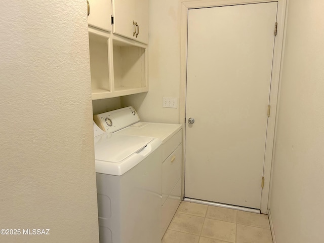 10211 E Hummingbird Meadow Way, Tucson, AZ 85747 - laundry area with cabinet space, a textured wall, washing machine and clothes dryer, and light tile patterned floors