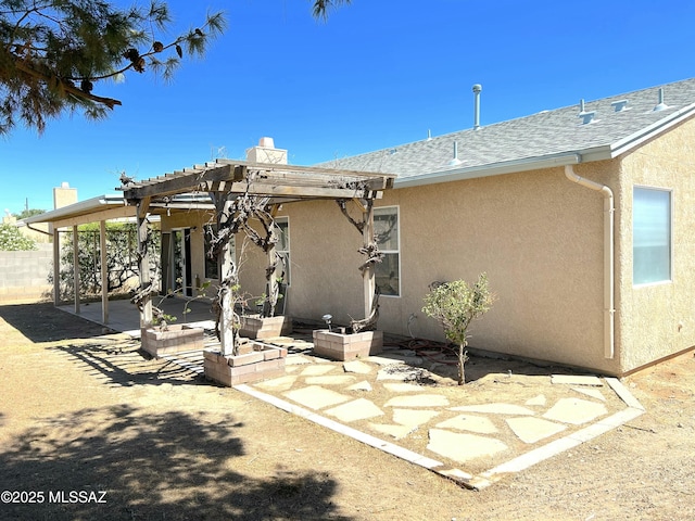 10211 E Hummingbird Meadow Way, Tucson, AZ 85747 - back of property with stucco siding, a pergola, a chimney, and a patio