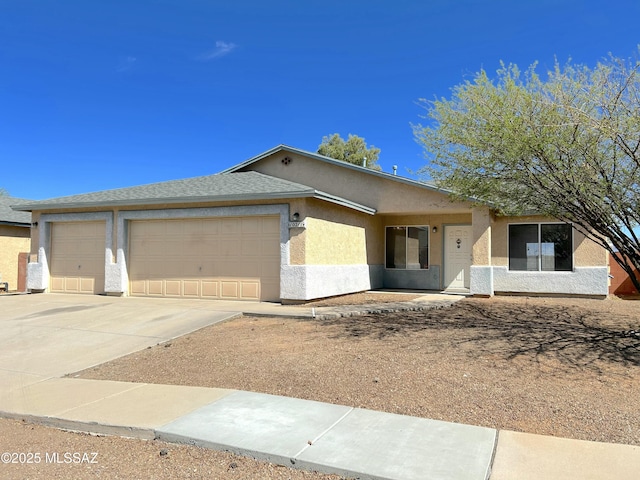 10211 E Hummingbird Meadow Way, Tucson, AZ 85747 - ranch-style house with stucco siding, an attached garage, and driveway