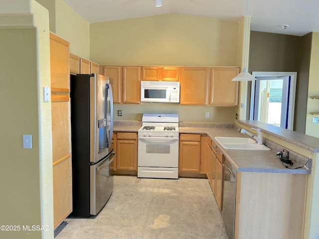 10211 E Hummingbird Meadow Way, Tucson, AZ 85747 - kitchen with vaulted ceiling, light brown cabinets, stainless steel appliances, and a sink