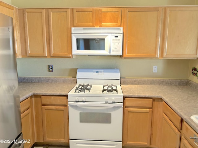 10211 E Hummingbird Meadow Way, Tucson, AZ 85747 - kitchen featuring white appliances and light countertops