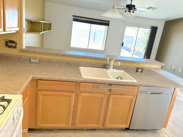 10211 E Hummingbird Meadow Way, Tucson, AZ 85747 - kitchen featuring dishwasher, visible vents, light brown cabinets, a sink, and gas range