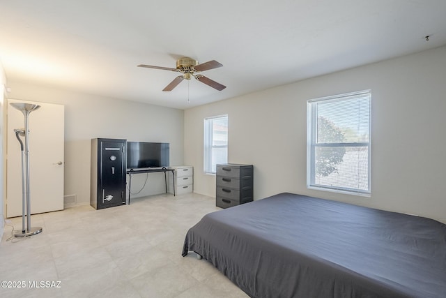 bedroom with visible vents and a ceiling fan