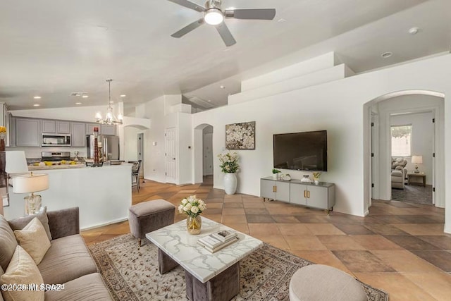 living room with recessed lighting, arched walkways, ceiling fan with notable chandelier, and lofted ceiling
