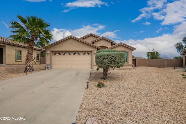 single story home featuring concrete driveway, fence, stucco siding, and a garage