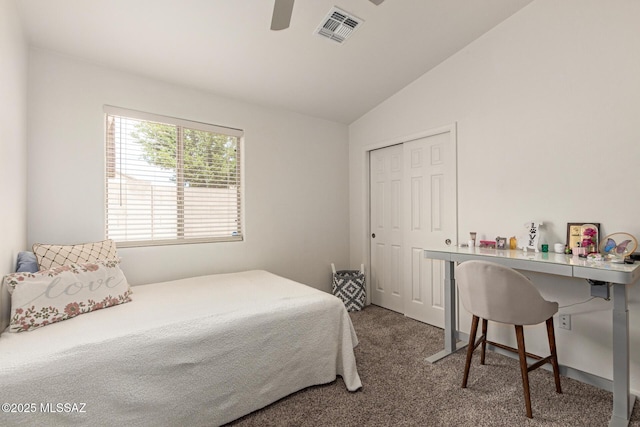bedroom with ceiling fan, carpet, lofted ceiling, visible vents, and a closet