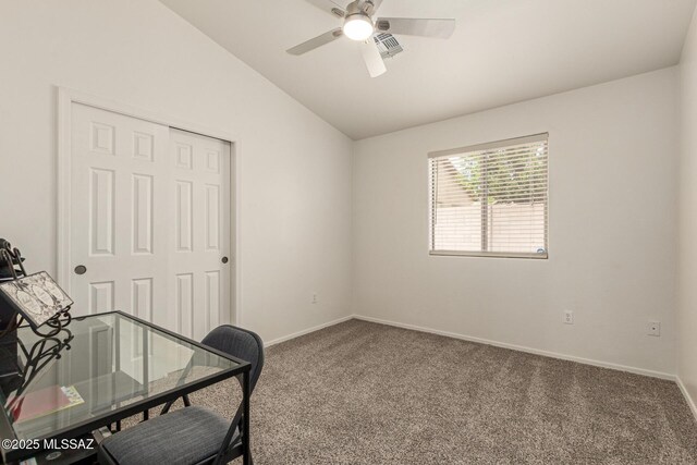 carpeted home office with baseboards, a ceiling fan, vaulted ceiling, and visible vents