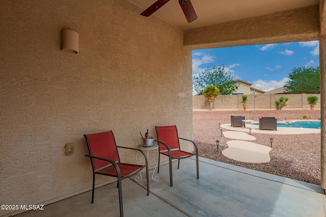 view of patio featuring a ceiling fan and a fenced backyard