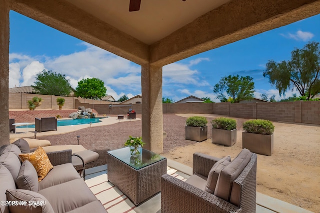 view of patio / terrace with a fenced in pool, a fenced backyard, and outdoor lounge area