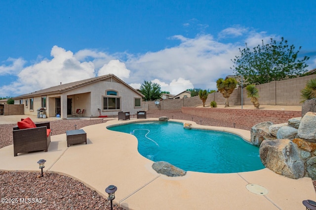 view of swimming pool with a fenced backyard, a fenced in pool, and a patio area