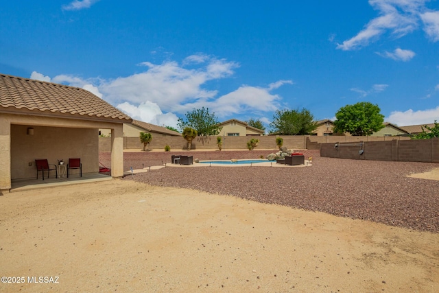 view of yard featuring a fenced backyard and a patio area