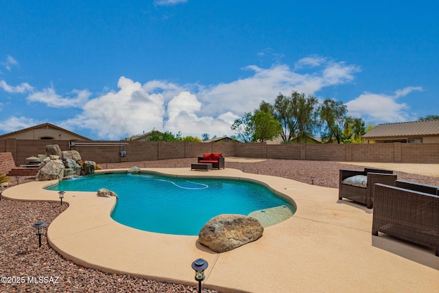 view of swimming pool with a patio, a fenced backyard, an outdoor hangout area, and a fenced in pool