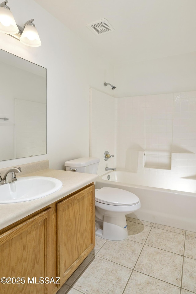 bathroom featuring vanity, tile patterned flooring, shower / bathtub combination, and toilet