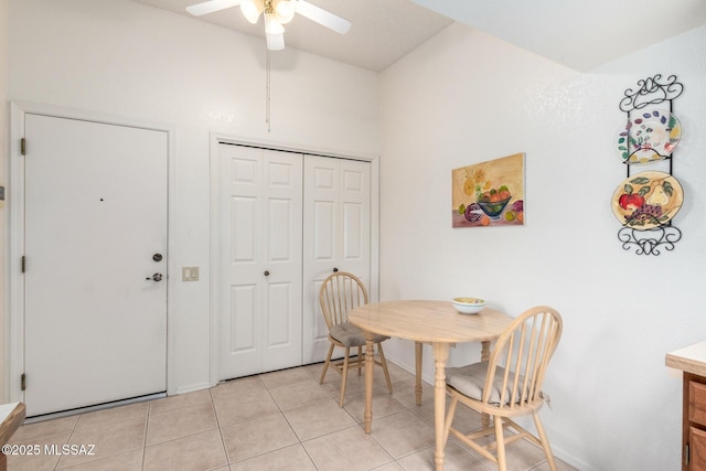 dining area with baseboards, light tile patterned floors, and ceiling fan