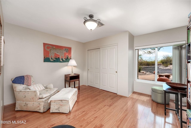 sitting room with light wood-style floors and baseboards