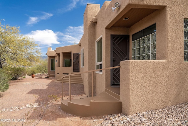 view of side of property with stucco siding