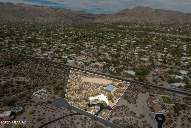 aerial view featuring a mountain view and a desert view