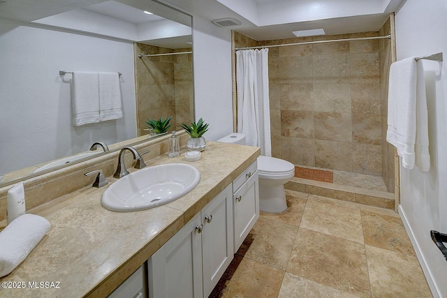 2714 W Magee Rd, Tucson, AZ 85742 - full bath with toilet, vanity, baseboards, visible vents, and tiled shower
