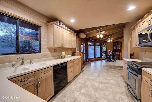 kitchen featuring recessed lighting, stainless steel appliances, light countertops, a ceiling fan, and a sink