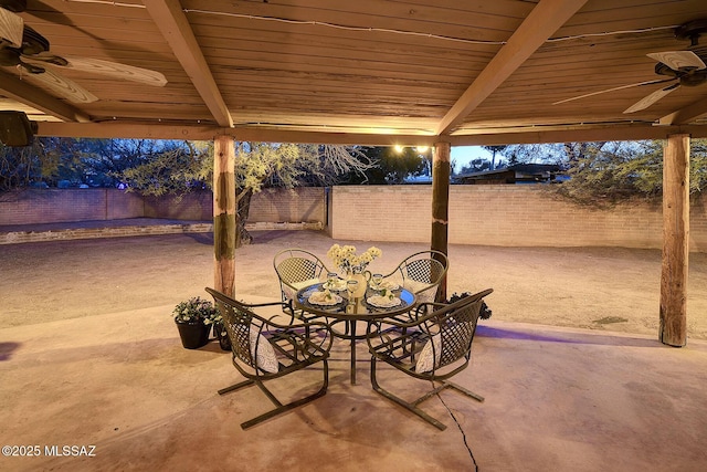 view of patio / terrace featuring a fenced backyard, a ceiling fan, and outdoor dining area