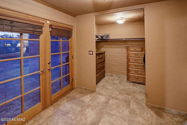 walk in closet with french doors