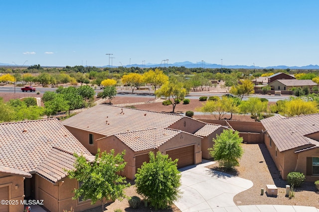 birds eye view of property with a mountain view