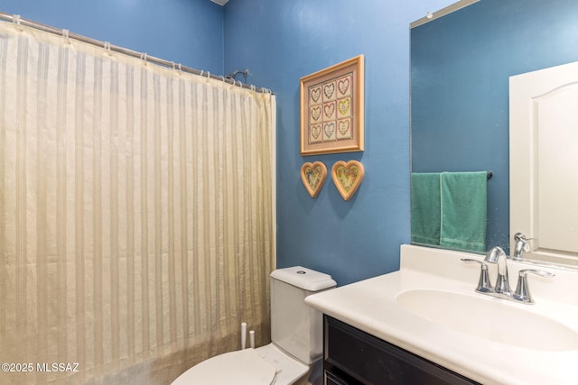 bathroom with toilet and vanity