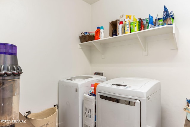 laundry room featuring washer and clothes dryer and laundry area