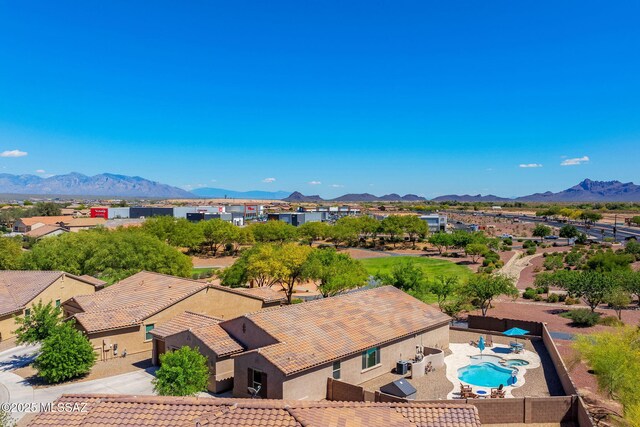 birds eye view of property with a mountain view