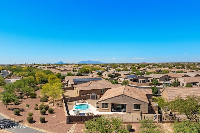 birds eye view of property with a residential view
