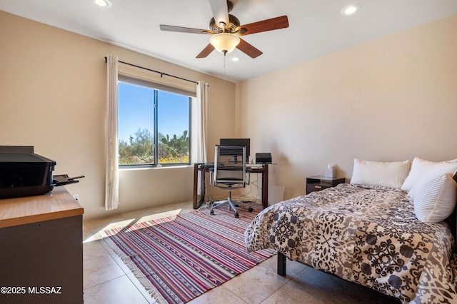 tiled bedroom featuring a ceiling fan and recessed lighting