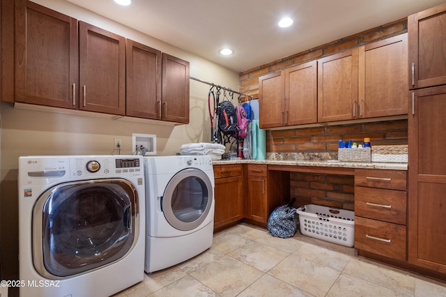 laundry room featuring cabinet space, washer and dryer, and recessed lighting