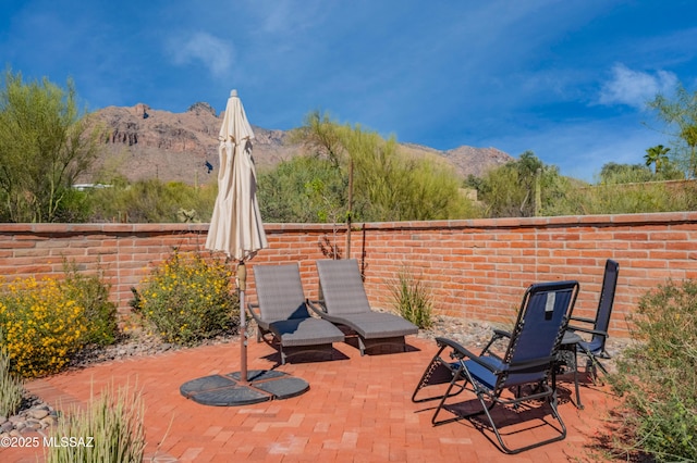 view of patio / terrace featuring a mountain view