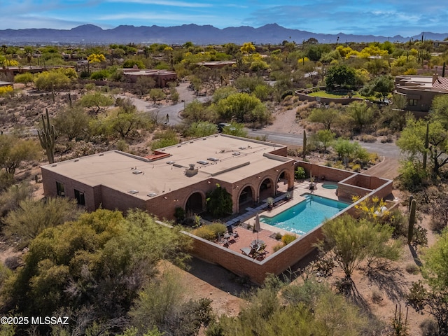 drone / aerial view featuring a mountain view