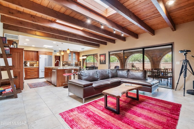 living area with recessed lighting, visible vents, wood ceiling, and beam ceiling