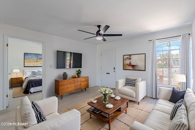 living area featuring ceiling fan