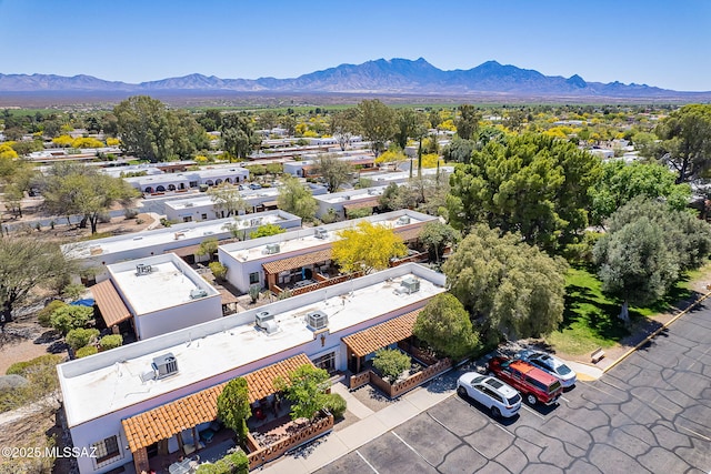 birds eye view of property with a mountain view