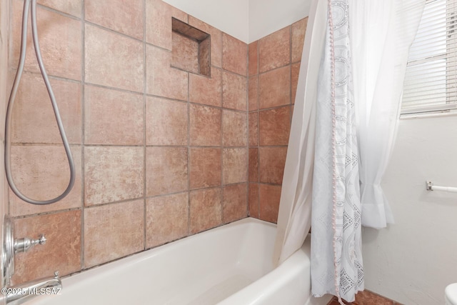 full bathroom with shower / tub combo with curtain