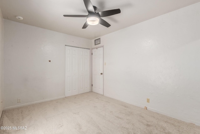 unfurnished bedroom with carpet floors, baseboards, and ceiling fan
