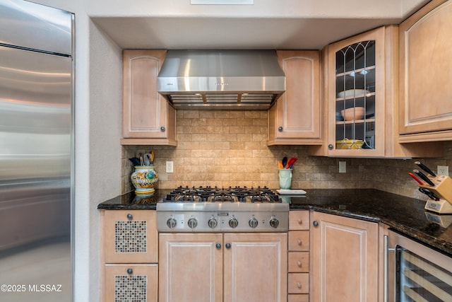 6261 N Placita De Rojelio, Tucson, AZ 85718 - kitchen with stainless steel appliances, beverage cooler, wall chimney exhaust hood, light brown cabinets, and tasteful backsplash