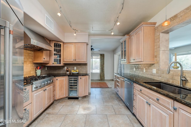 6261 N Placita De Rojelio, Tucson, AZ 85718 - kitchen featuring a sink, light brown cabinetry, and wine cooler