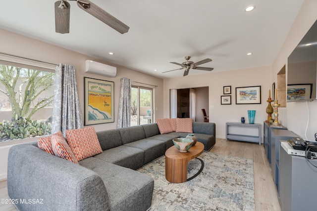 6261 N Placita De Rojelio, Tucson, AZ 85718 - living area with a ceiling fan, a wall unit AC, light wood-style flooring, and recessed lighting