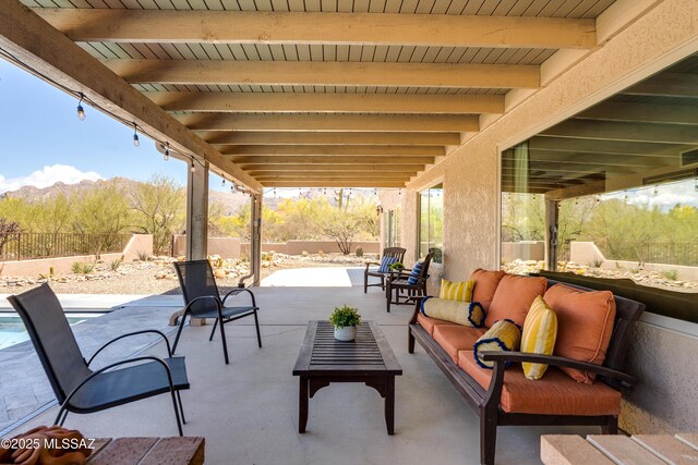 6261 N Placita De Rojelio, Tucson, AZ 85718 - view of patio featuring a fenced backyard, an outdoor living space, and a mountain view